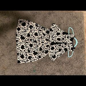 Midi dress that is black, white, and light pink. Good for formal occasion.